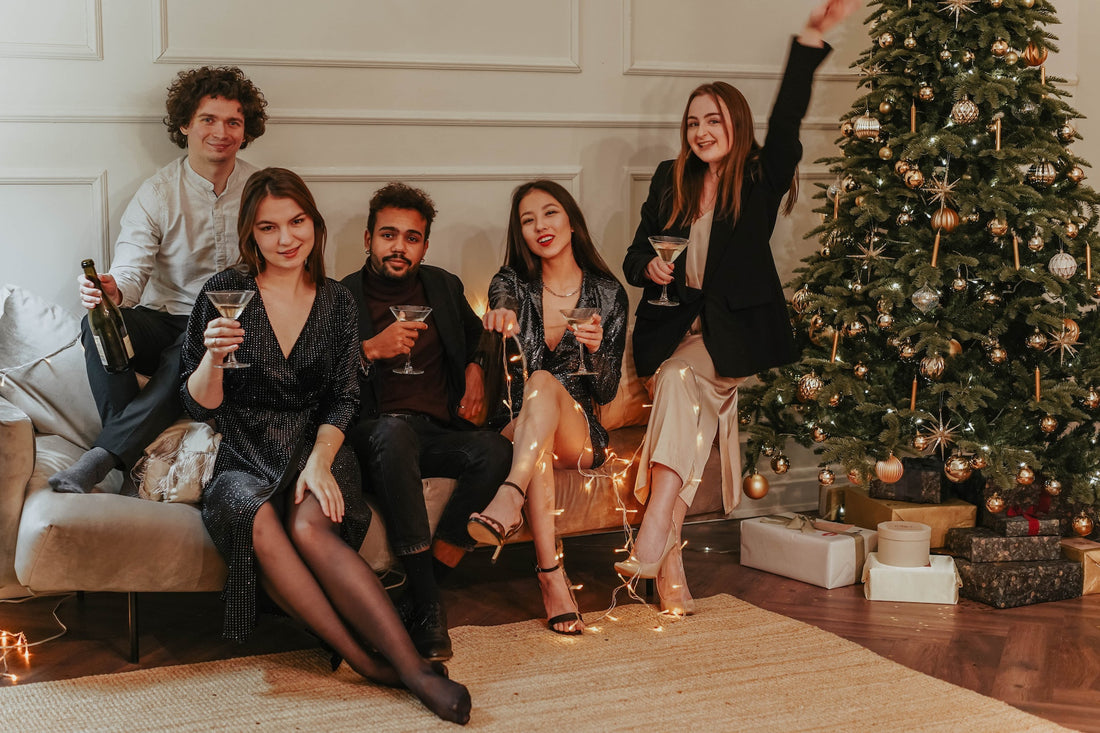  people enjoying a New Year’s Eve party while sitting on a couch